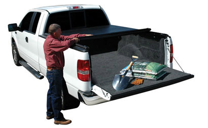 White truck with roll-up Extang soft tonneaus
